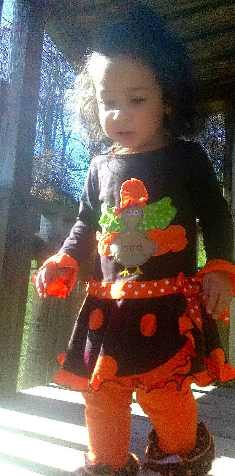 Kailani joined the competition — help win amazing prizes! baby_toddler_clothing, child, christmas, christmas_ornament, doll, event, happy, holiday, orange, pattern, person, pink, sitting, sleeve, stuffed_toy, t_shirt, textile, toddler, toy, tree
