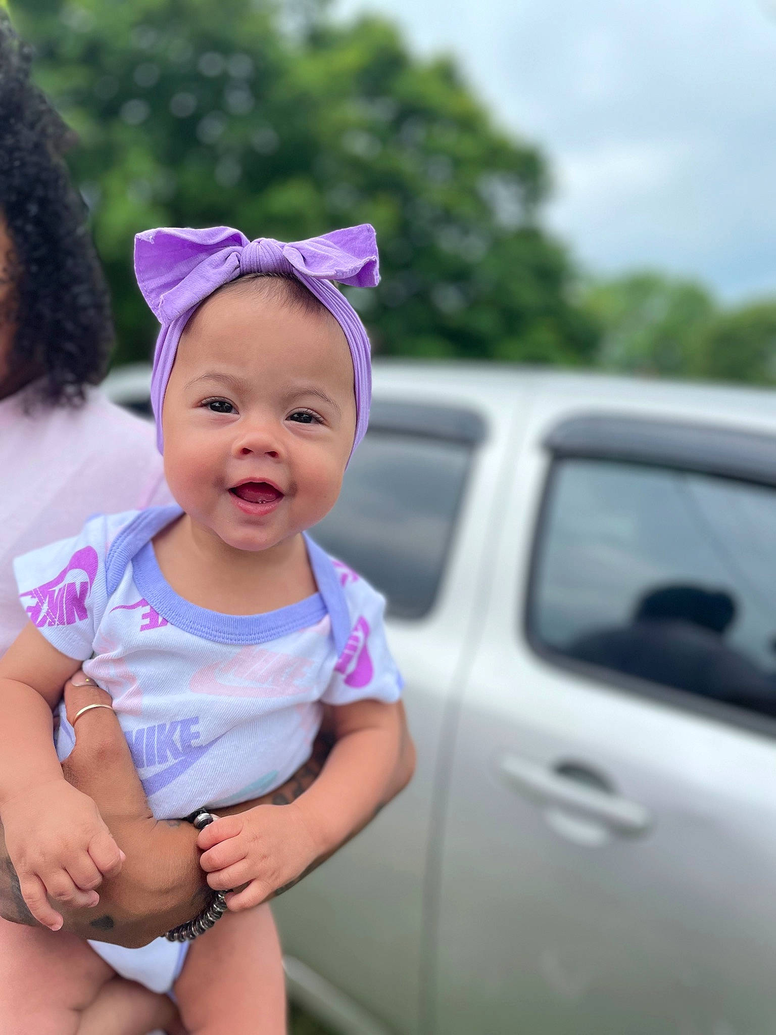 Azariah joined the competition — help win amazing prizes! automotive_exterior, automotive_lighting, baby, baby_toddler_clothing, bumper, cap, car, clothing, grass, happy, hood, leisure, magenta, motor_vehicle, person, pink, plant, rim, toddler, vehicle