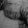 baby, sleeping, smile, pillow, blanket, infant, bed, hand, face, peaceful, monochrome, closeup, rest, cozy, child, newborn, soft, cute, portrait, calm