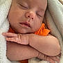 Timothy joined the competition — help win amazing prizes! baby, sleeping, infant, blanket, orange_clothing, peaceful, closeup, skin, hand, face, newborn, soft_texture, cozy, wrapped, cute, rest, child, portrait, relaxation, toddler
