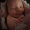 Everleigh joined the competition — help win amazing prizes! newborn, baby, infant, child, sleeping, smiling, face, portrait, pink, swaddled, blanket, fluffy, cozy, indoors, dim_lighting, close_up, head, eyes, nose, photography