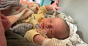 Heidi Lynn joined the competition — help win amazing prizes! baby, sleeping, blanket, pacifier, hand, cozy, soft, infant, clothing, bed, comfort, cute, rest, nursery, warm, face, peaceful, newborn, portrait, indoors