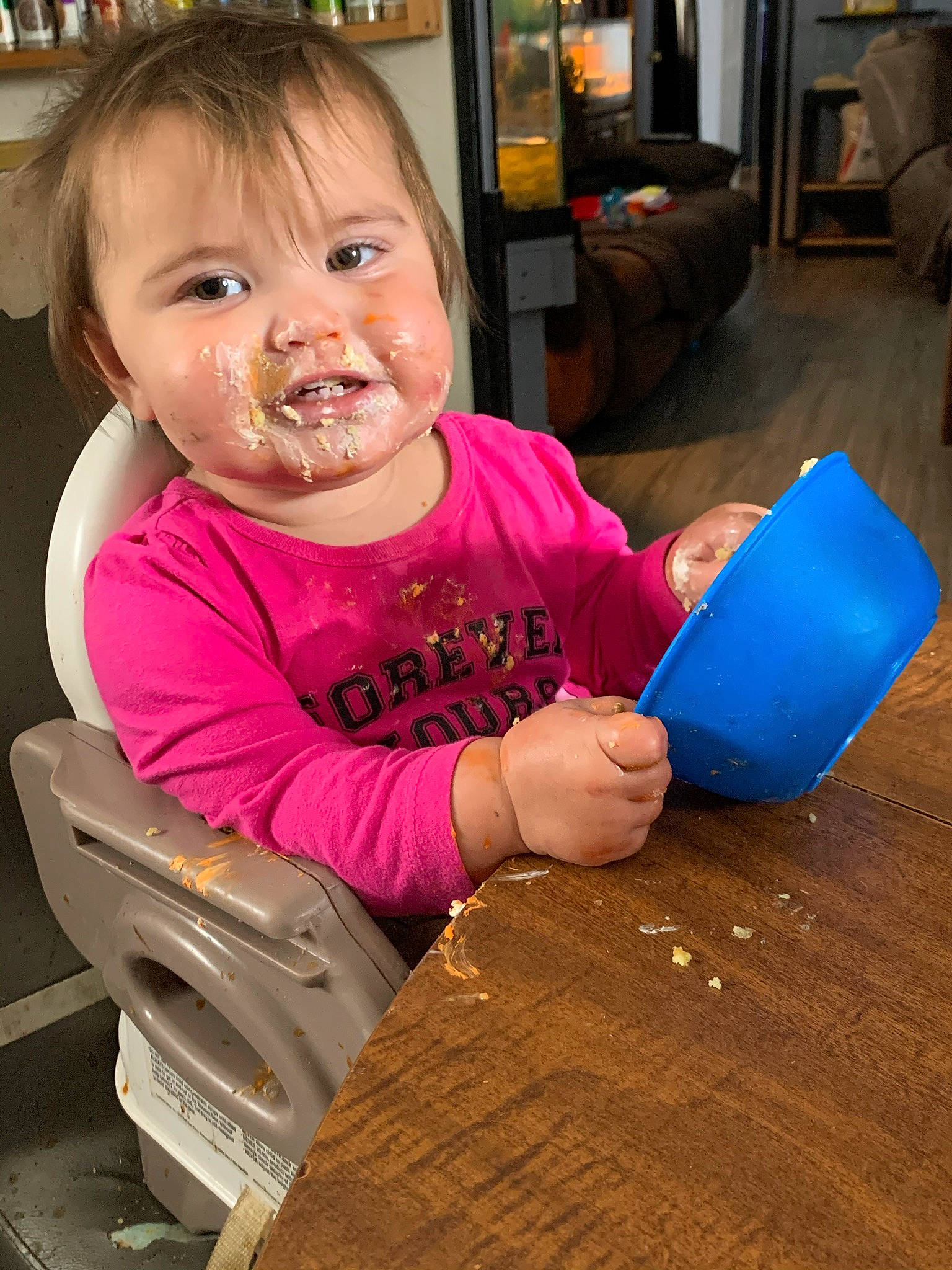 Isabella is registered to the contest to win money with this photo: baby, baby_toddler_clothing, child, couch, eye, nail, person, picture_frame, plastic, shelf, shelving, television, toddler, varnish, wood_stain