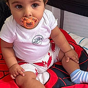 Lucas joined the competition — help win amazing prizes! baby, pacifier, white_shirt, shorts, red_lobsters, red_blanket, spider_web_pattern, blue_socks, cute, chubby_legs, sitting, indoors, child, infant, smiling_text, curly_hair, large_eyes, comfortable, cozy, playpen