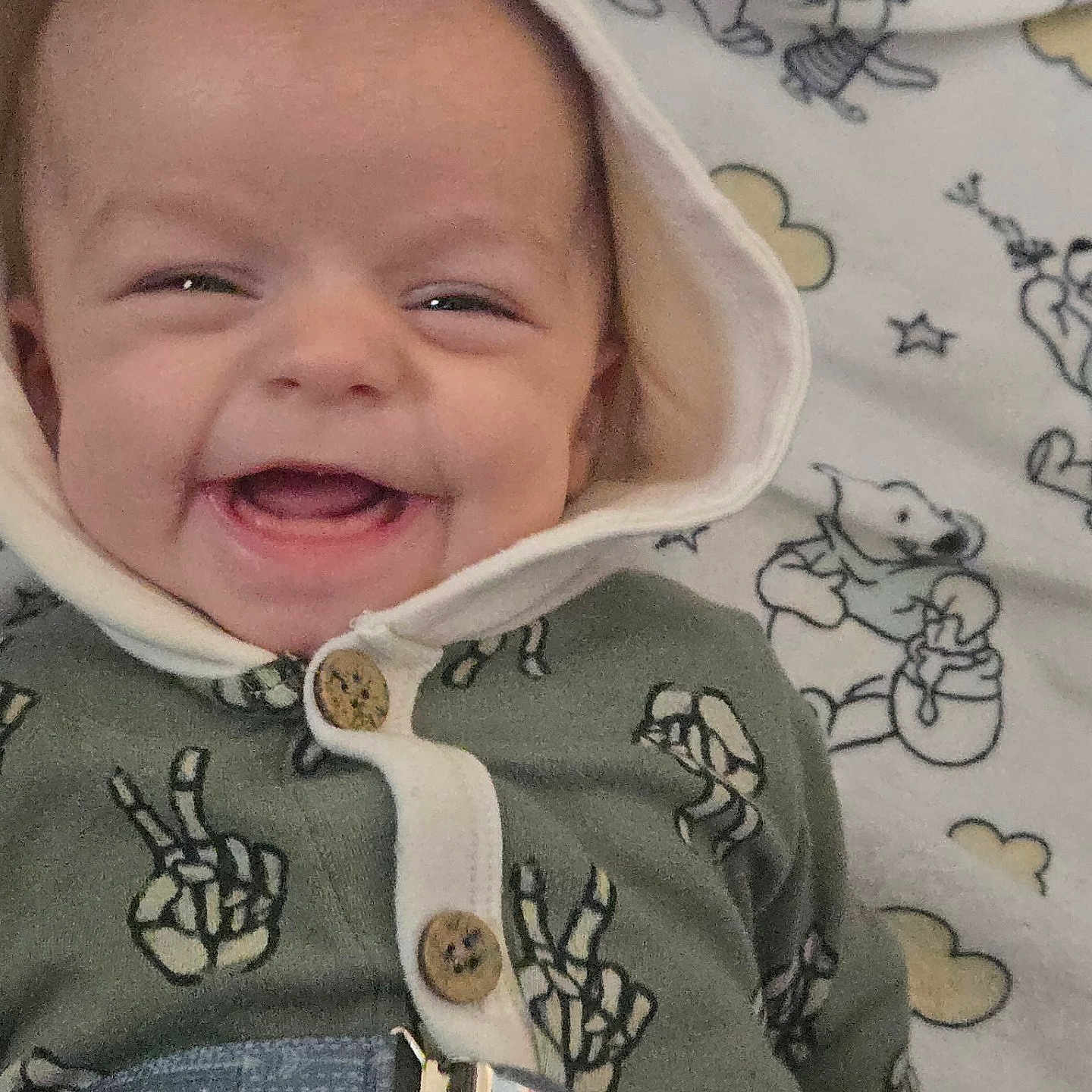 Sonnie joined the competition — help win amazing prizes! baby, bear, blanket, button, cartoon, child, clothing, cloud, comfort, cute, fabric, face, happy, hood, indoors, infant, lying_down, pattern, peace_sign, smile