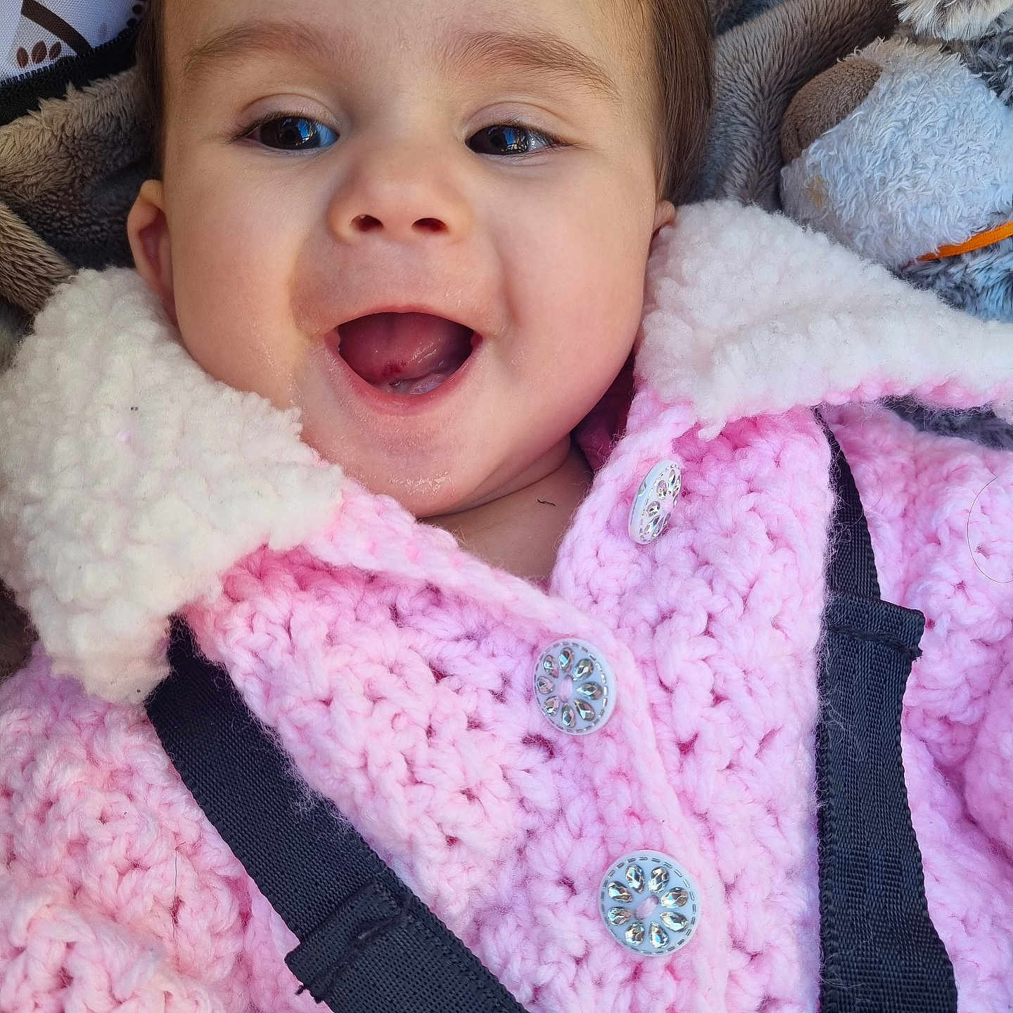 Alya is registered to the contest to win money with this photo: accessories, baby, bodypart, clothing, coat, face, happy, head, jacket, knitwear, laughing, lifejacket, mouth, person, photography, portrait, purple, strap, sweater, vest