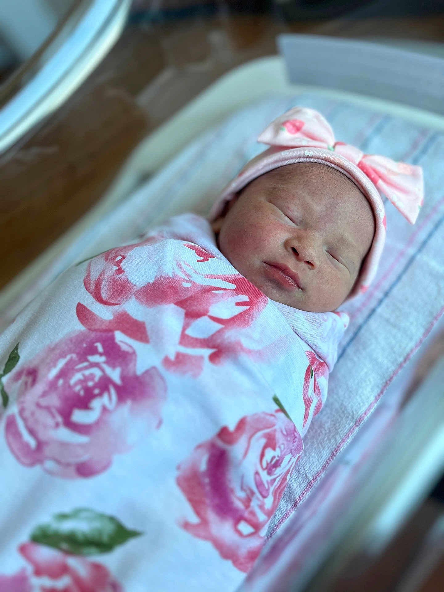 Elizabeth joined the competition — help win amazing prizes! newborn, baby, swaddled, sleeping, hat, bow, floral, blanket, towel, hospital, bassinet, infant, peaceful, cute, portrait, closeup, skin, face, headwear, resting