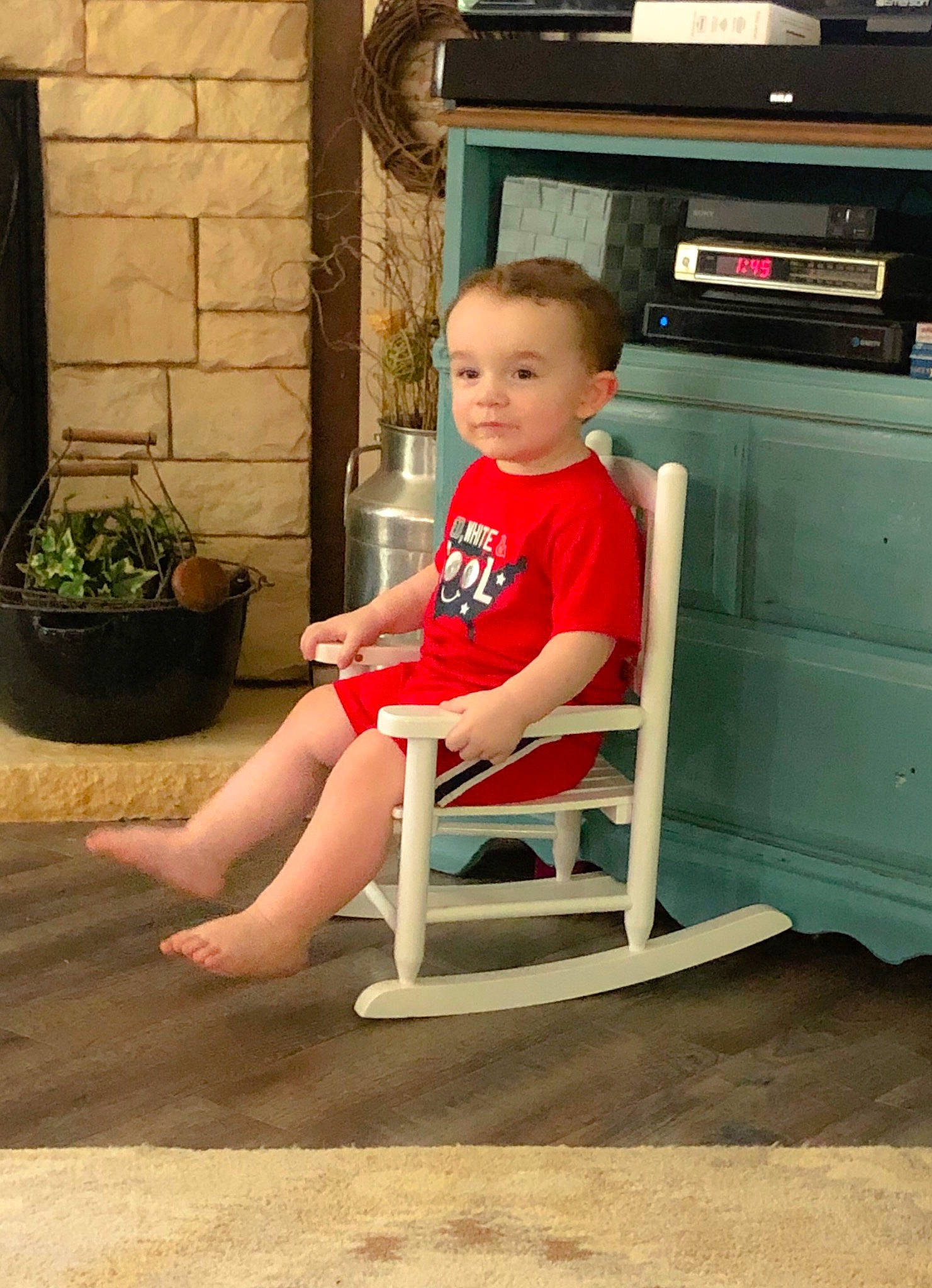 Kye is registered to the contest to win money with this photo: chair, child, floor, flooring, furniture, leg, outdoor_furniture, person, sitting, table, toddler