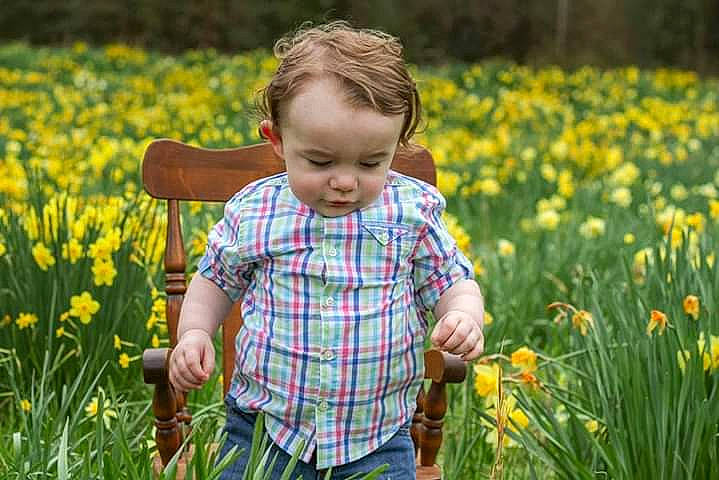 Kye joined the competition — help win amazing prizes! baby, botany, child, flower, flowering_plant, fun, grass, grassland, happy, iris, meadow, people_in_nature, person, plant, prairie, smile, spring, toddler, wildflower, yellow