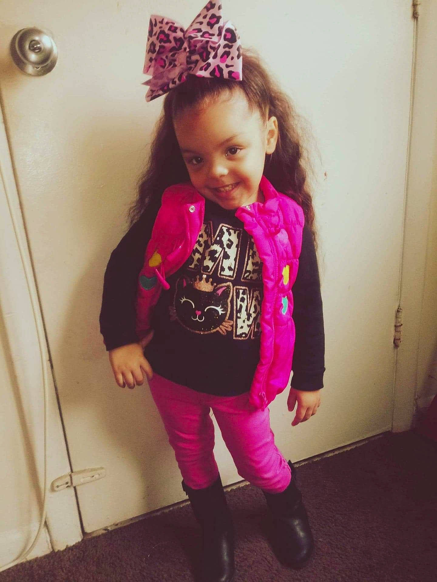 Rose is registered to the contest to win money with this photo: child, cool, ear, face, fashion, footwear, hair, hair_accessory, hairstyle, head, headgear, headpiece, joy, lip, magenta, outerwear, person, pink, purple, standing