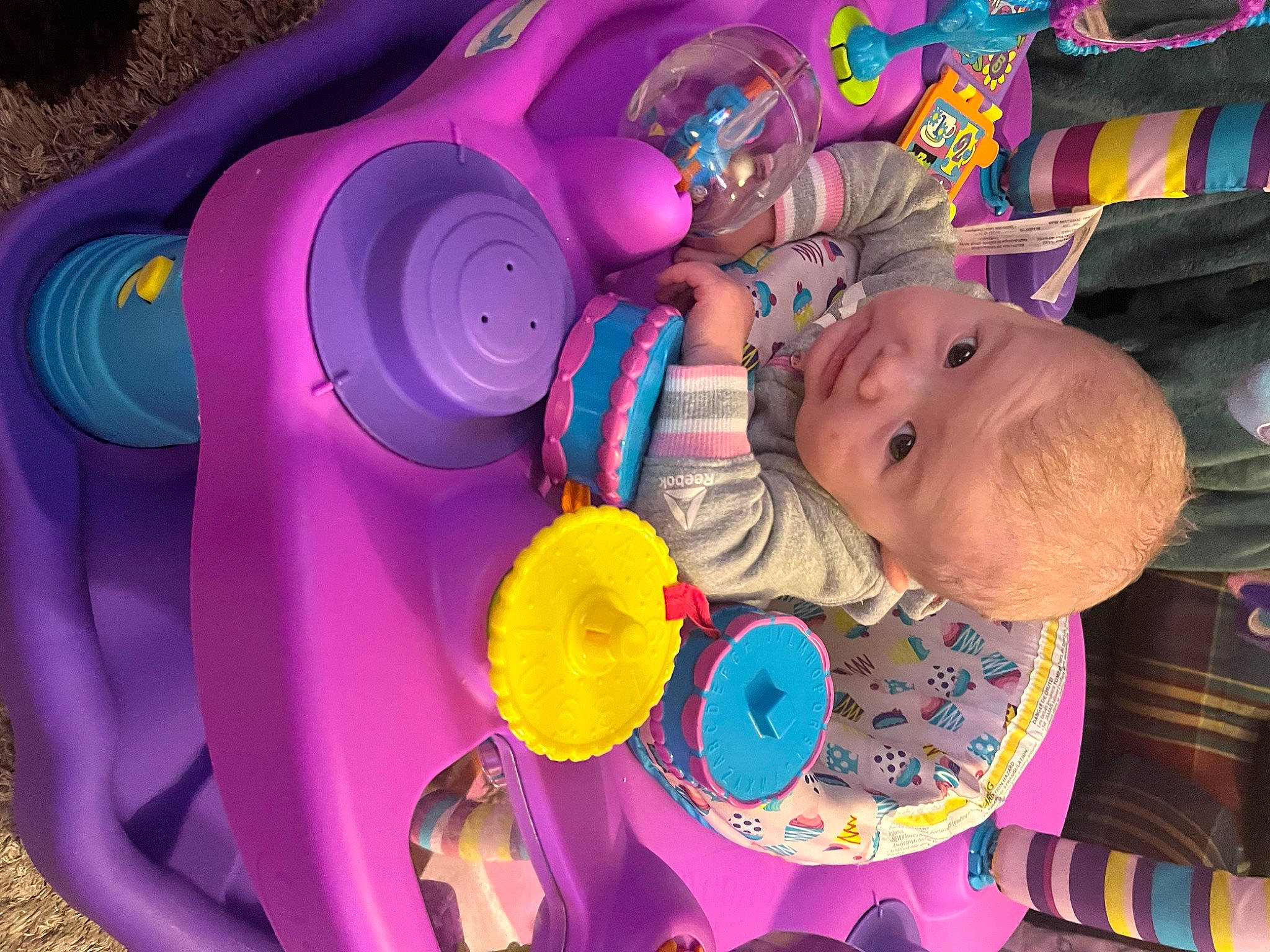 Paisley is registered to the contest to win money with this photo: automotive_tire, automotive_wheel_system, baby, baby_products, child, circle, facial_expression, fun, happy, leisure, magenta, person, pink, play, purple, textile, toddler, toy, violet, water