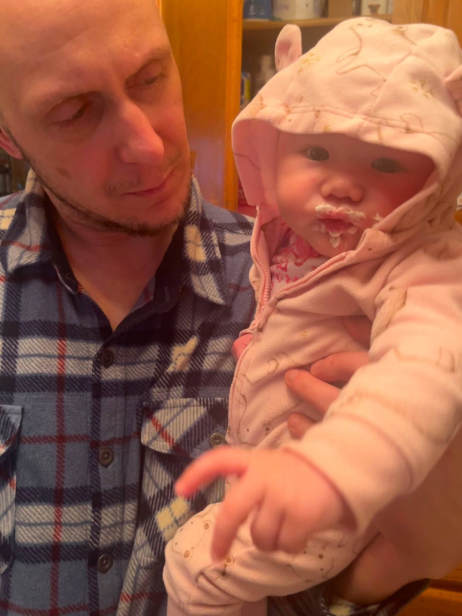 Paisley is registered to the contest to win money with this photo: baby, baby_toddler_clothing, cap, cheek, chin, cool, ear, eye, facial_expression, finger, gesture, happy, headwear, iris, mouth, nose, person, plaid, skin, smile