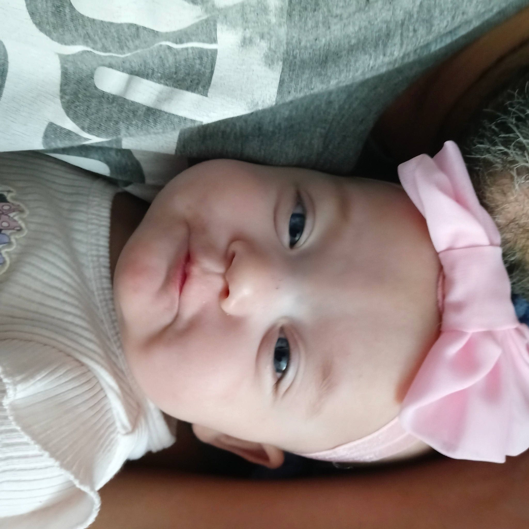 Galaxy is registered to the contest to win money with this photo: baby, baby_toddler_clothing, cheek, child, comfort, eyebrow, eyelash, grass, happy, headwear, human_body, iris, lip, mouth, nose, person, plant, skin, smile, toddler