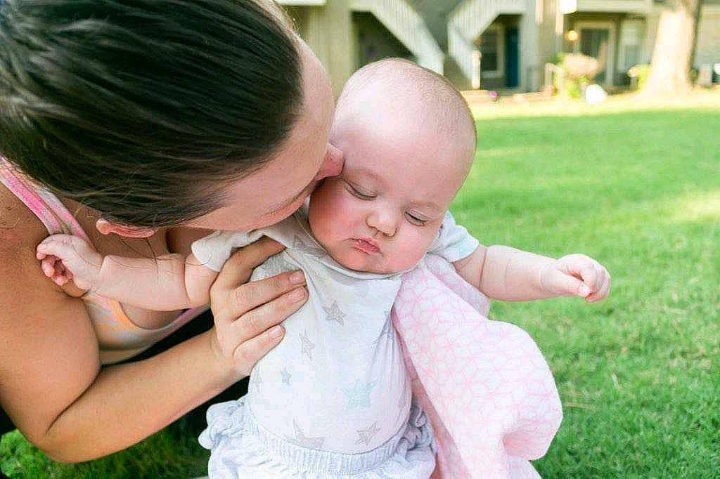 Galaxy is registered to the contest to win money with this photo: baby, baby_toddler_clothing, ceremony, child, dress, event, finger, fun, gesture, grass, happy, jewellery, leisure, love, people_in_nature, person, pink, plant, sitting, skin