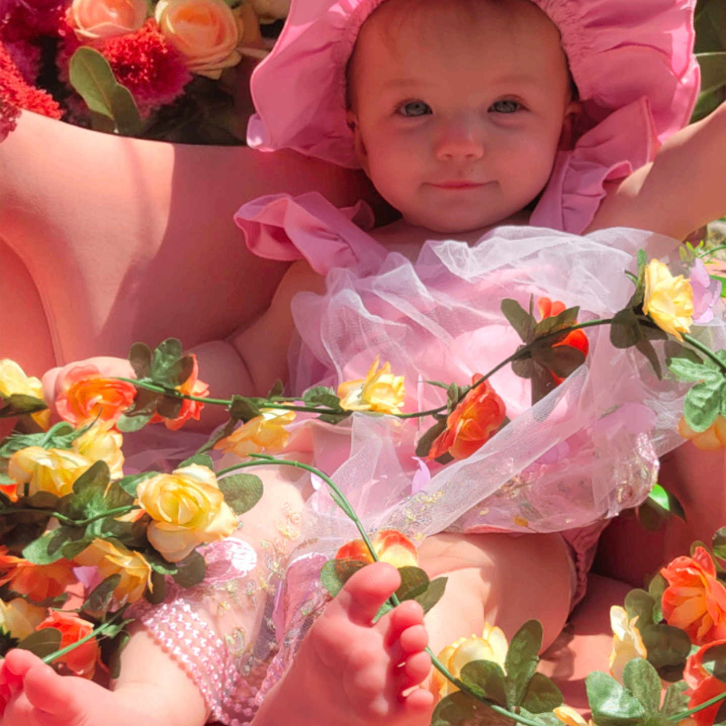 Gracelynn is registered to the contest to win money with this photo: baby, bonnet, clothing, daisy, dress, face, flower, flowerarrangement, flowerbouquet, geranium, hat, head, leaf, person, petal, photography, plant, portrait, pottedplant, rose