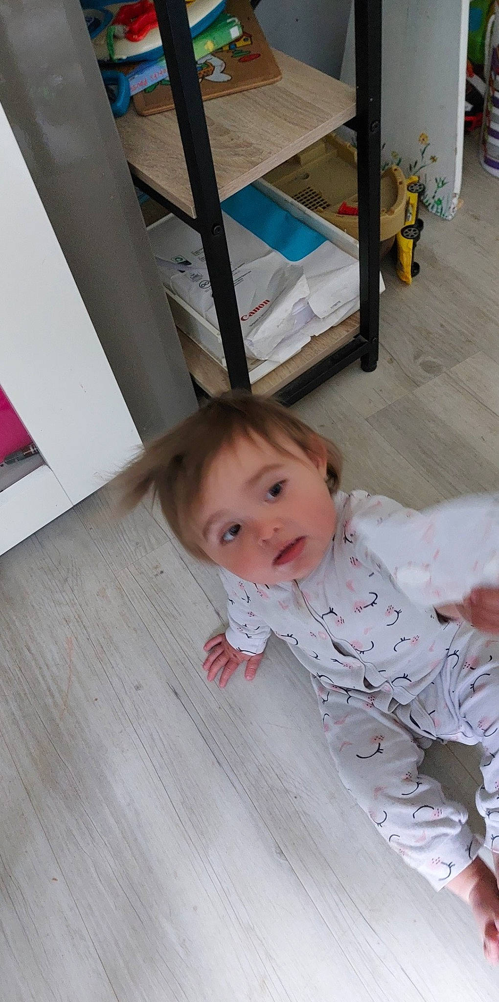 Lola participe au concours pour gagner de l'argent avec cette photo : baby, baby_products, baby_toddler_clothing, cheek, child, comfort, crawling, eye, floor, flooring, fun, hardwood, linens, person, room, sitting, toddler, varnish, wood, wood_flooring