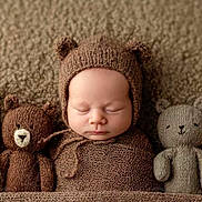 Dayanna participe au concours pour gagner de l'argent avec cette photo : adorable, baby, bear_ears, brown_blanket, child, closeup, cozy, cute, infant, knitted_hat, knitted_toys, knitwear, newborn, portrait, resting, sleep, sleeping, soft_texture, stuffed_animals, warm_colors