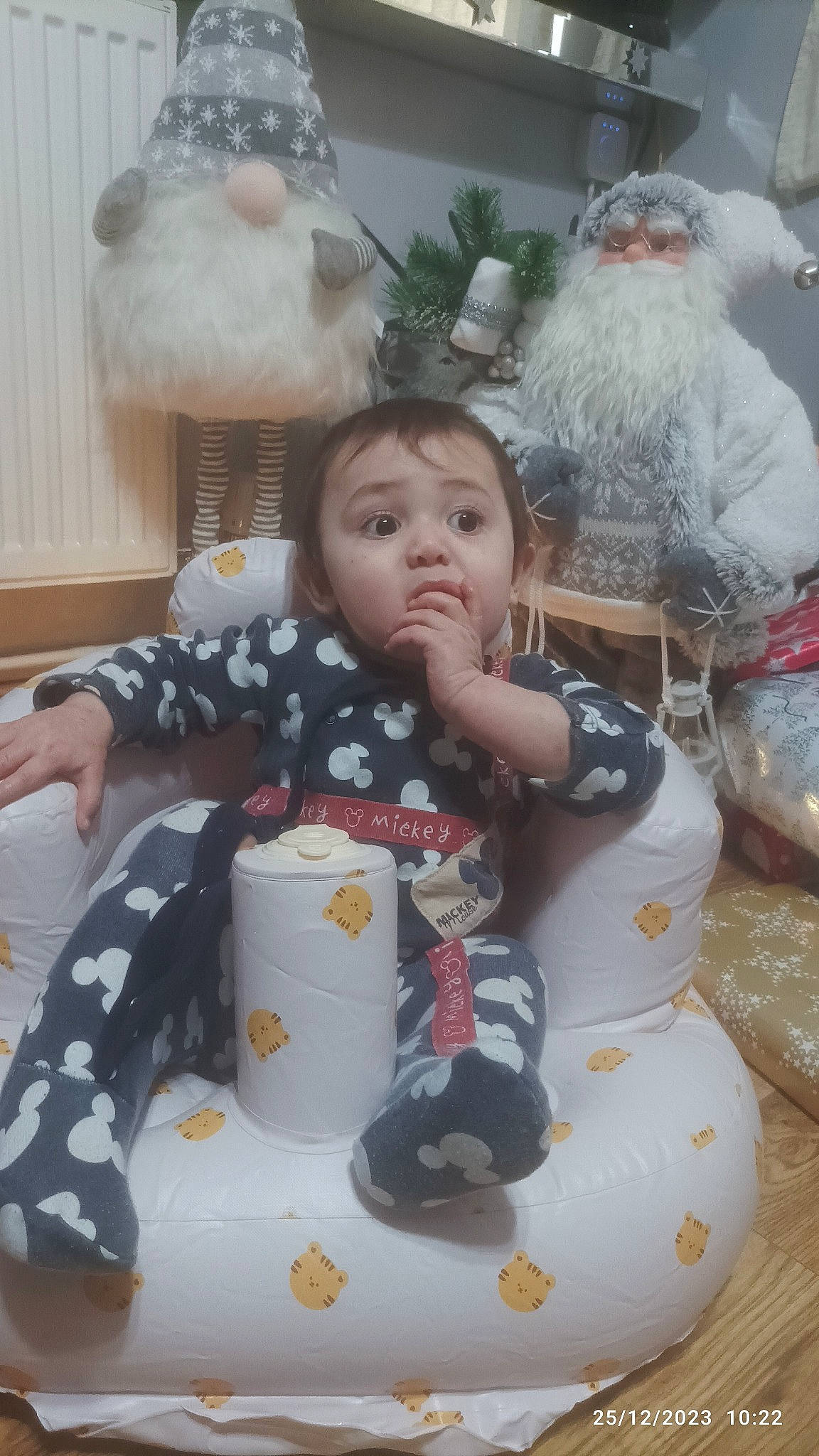 Alfredo is registered to the contest to win money with this photo: baby, baby_toddler_clothing, beard, child, christmas, christmas_eve, event, head, holiday, lap, mammal, ornament, person, sitting, sleeve, stuffed_toy, surprise, textile, toddler, toy