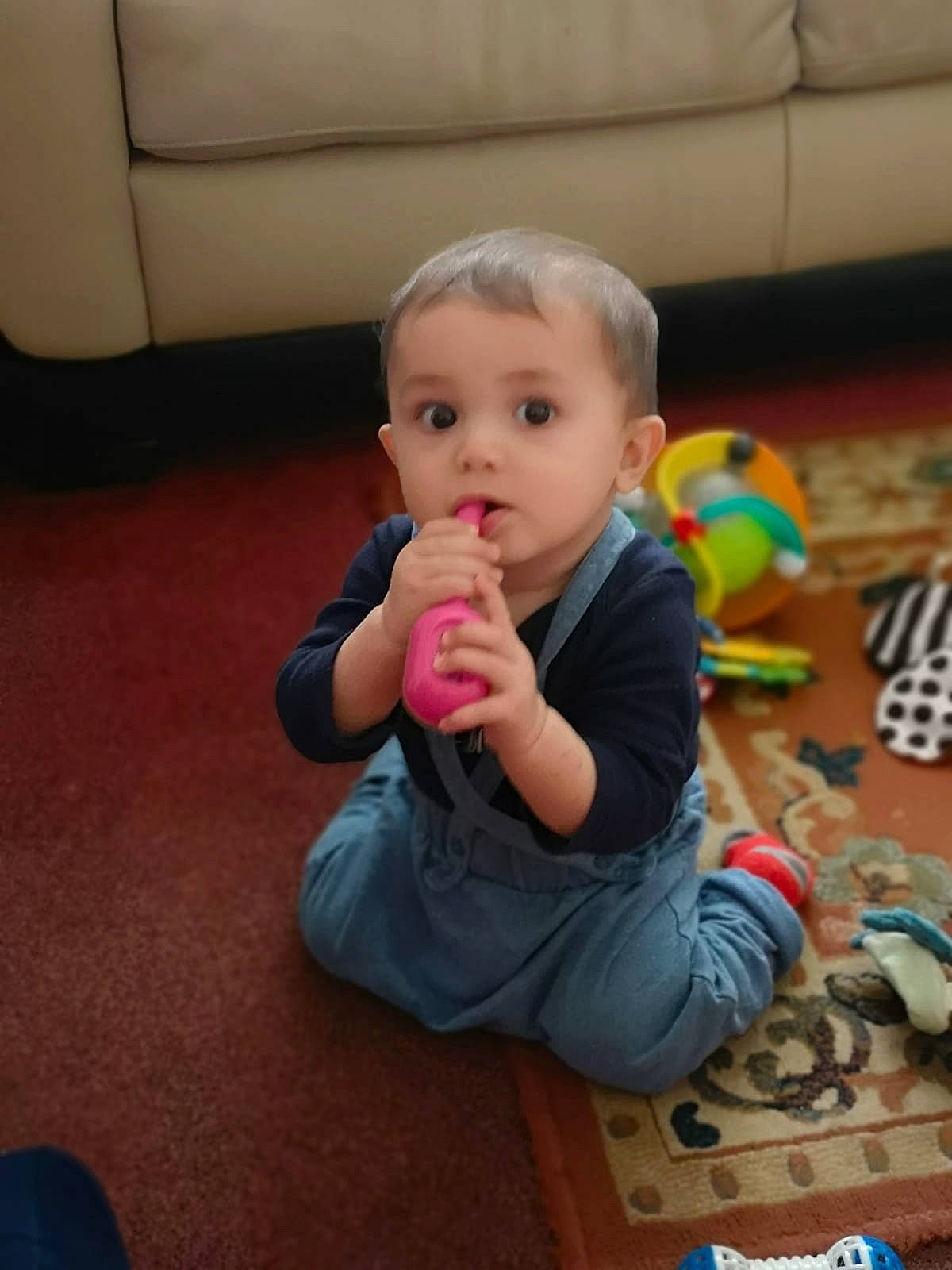 Alfredo is registered to the contest to win money with this photo: baby, baby_playing_with_toys, baby_products, baby_toys, cheek, child, comfort, floor, flooring, fun, human_body, leisure, nose, person, play, room, sitting, surprise, thumb, toddler