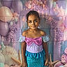 Mya participe au concours pour gagner de l'argent avec cette photo : child, mermaid_costume, balloons, seashells, starfish, underwater_theme, purple, blue, pink, dress, earrings, smiling, standing, decorations, party, festive, background, portrait, cute, celebration