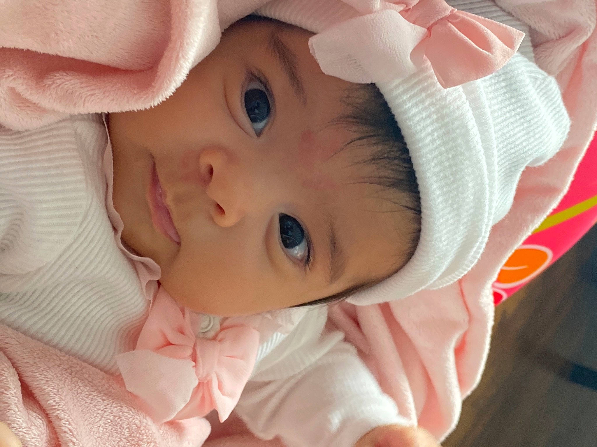 Esmeralda is registered to the contest to win money with this photo: baby, baby_toddler_clothing, cheek, chin, eye, eyebrow, eyelash, hand, happy, head, headgear, headwear, iris, lip, mammal, mouth, nose, person, pink, skin