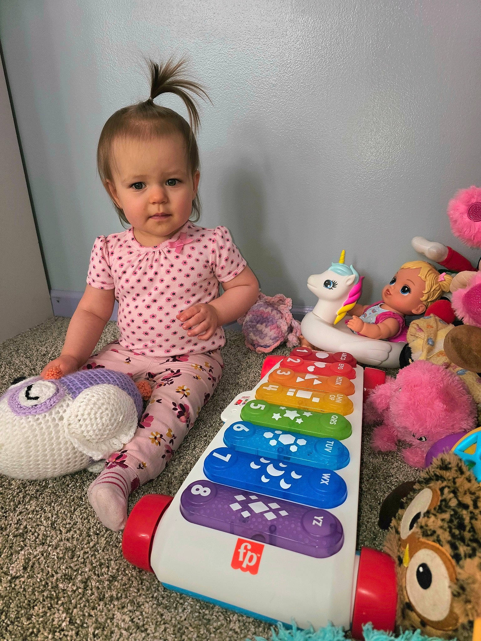 Maizie joined the competition — help win amazing prizes! baby, baby_playing_with_toys, baby_toddler_clothing, baby_toys, child, doll, event, pattern, person, pink, play, purple, room, sitting, stuffed_toy, sweetness, t_shirt, teddy_bear, textile, toddler