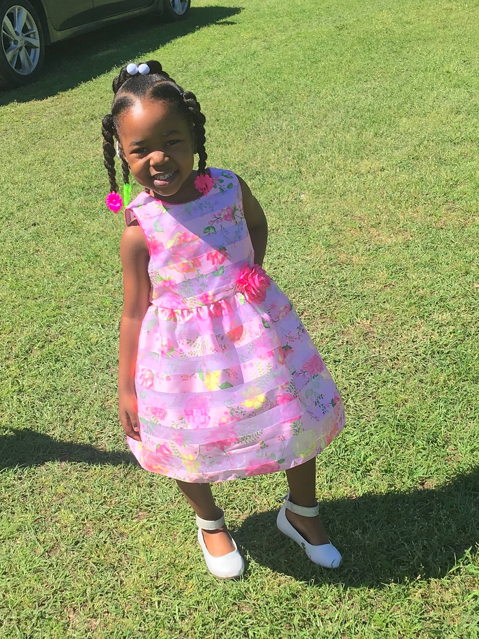 Syleena is registered to the contest to win money with this photo: child, dress, footwear, fun, grass, happy, joy, lawn, person, pink, plant, play, recreation, shoe, smile, summer, toddler, tree, vacation