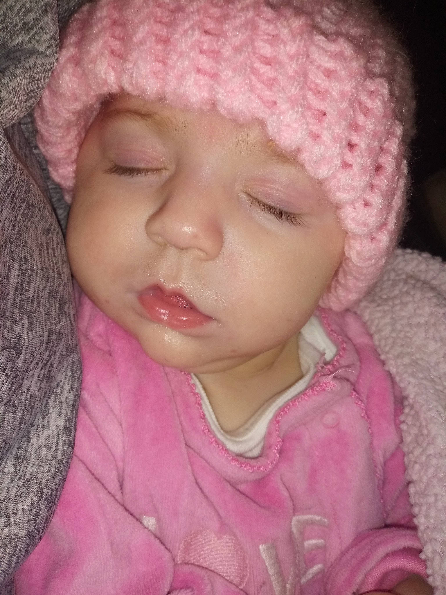 Chloe is registered to the contest to win money with this photo: baby, bonnet, cheek, child, chin, close_up, eye, face, forehead, head, headgear, knit_cap, knitting, lip, mouth, nose, person, pink, skin, toddler