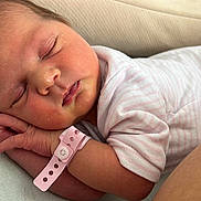 Leyria a rejoint le concours — aidez-le/la à gagner de superbes lots ! newborn, baby, sleeping, infant, pink, striped_clothing, hospital_wristband, face, hand, skin, cushion, comfort, peaceful, resting, closeup, portrait, child, person, bed, soft