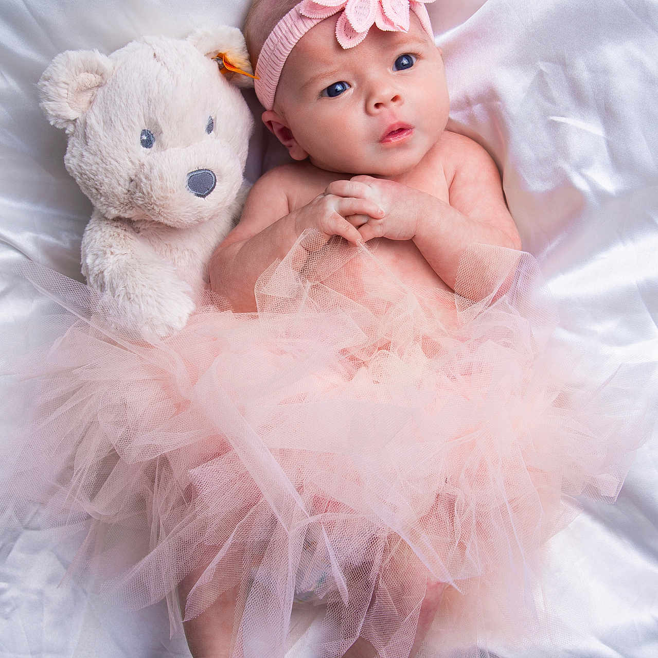 Melanie Anna is registered to the contest to win money with this photo: accessories, baby, bodypart, clothing, couch, doll, dress, face, finger, formalwear, furniture, hand, head, headband, newborn, person, photography, portrait, teddybear, toy