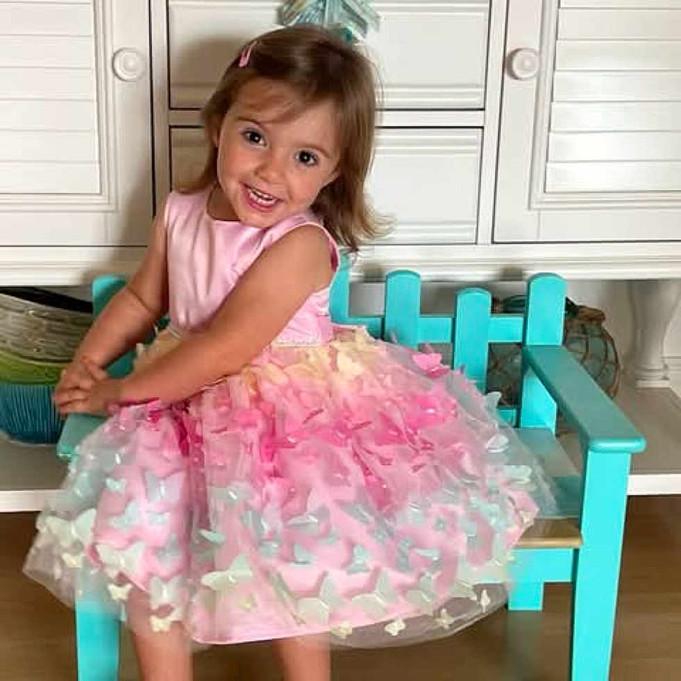 Scarlett joined the competition — help win amazing prizes! baby, babylaughing, chair, child, clothing, dress, face, female, furniture, girl, happy, head, laughing, person, photography, portrait, sitting, sleeve, smile, surprised