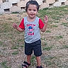 backyard, casual, child, daylight, feet, fence, grass, happy, nature, outdoor, person, playful, sandals, shirt, shorts, smiling, standing, summer, toddler, young