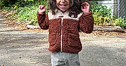 Art Iv is registered to the contest to win money with this photo: casual_clothing, child, curly_hair, cute, daylight, fence, greenery, happy, jacket, nature, outdoor, pants, path, person, playful, smiling, sneakers, trees, walking, wood