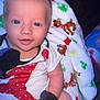 Kaiser joined the competition — help win amazing prizes! baby, infant, smiling, onesie, mittens, blanket, christmas, holiday, reindeer, cozy, cute, child, face, blue_eyes, indoor, person, portrait, happy, clothing, sitting