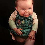 Trinity-Jae joined the competition — help win amazing prizes! baby, infant, child, face, smile, denim, overall, clothing, cute, sitting, hands, cheeky, portrait, young, expression, person, pink, long_sleeve, background, studio