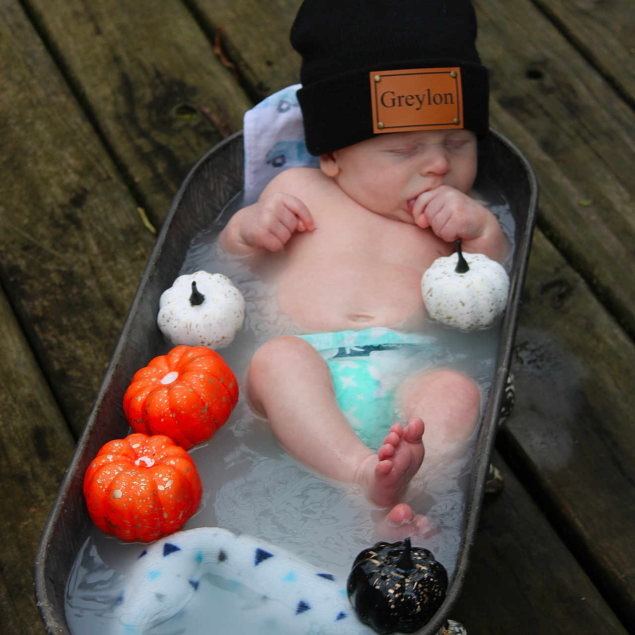 Greylon is registered to the contest to win money with this photo: baby, bathtub, beanie, blanket, cute, decor, diaper, fall, hat, infant, milky_water, outdoor, peaceful, pumpkin, relaxing, seasonal, sleeping, small_pumpkins, water, wood