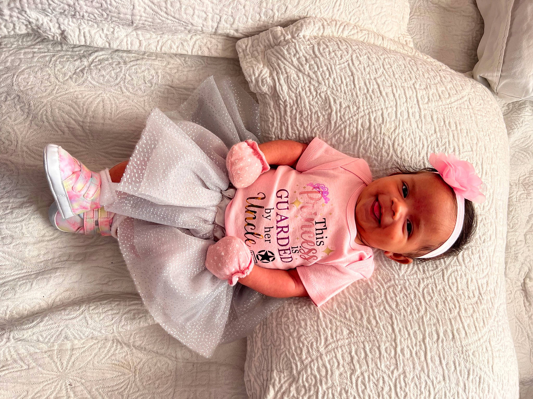 Devin is registered to the contest to win money with this photo: baby, baby_products, baby_sleeping, baby_toddler_clothing, bedding, child, comfort, fashion_accessory, finger, hand, headgear, joy, linens, pattern, person, pink, plant, room, skin, sleeve