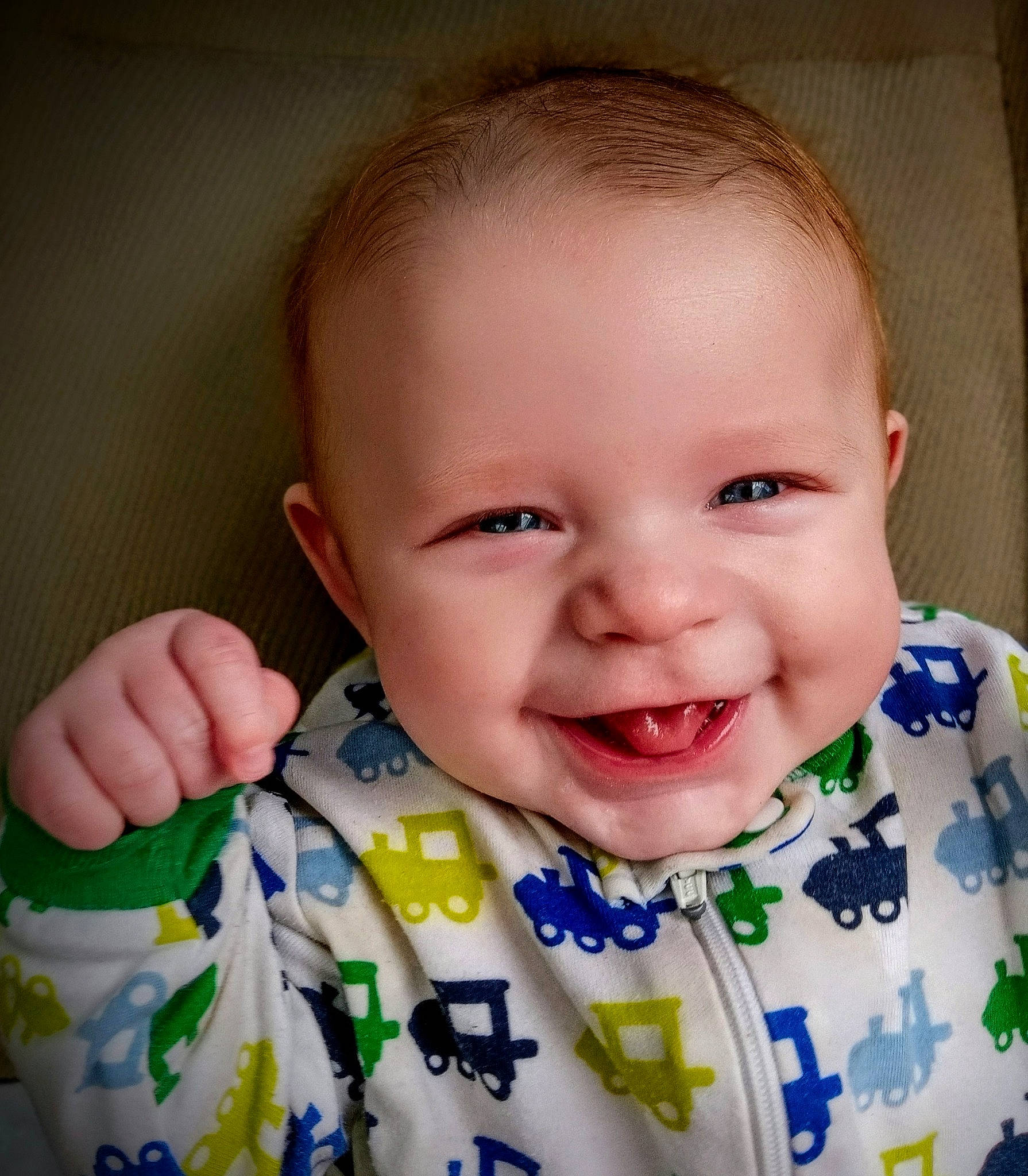 Jaxon is registered to the contest to win money with this photo: arm, baby_toddler_clothing, cheek, chin, eye, eyebrow, facial_expression, happy, human_body, iris, joy, lip, mouth, neck, nose, outerwear, person, product, skin, sleeve