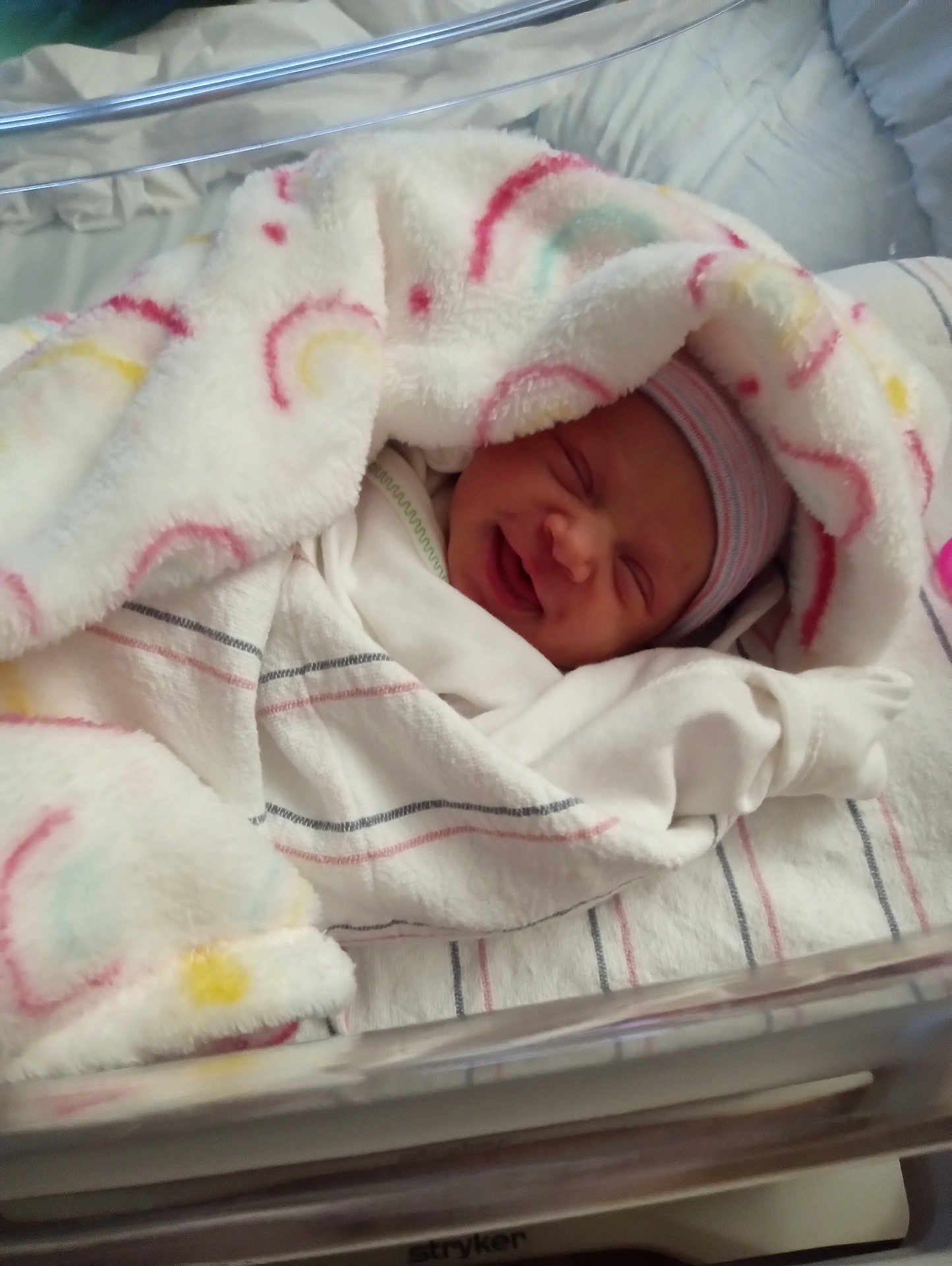 Lena joined the competition — help win amazing prizes! newborn, baby, blanket, hospital, bassinet, smile, infant, wrapped, bed, clothing, hat, sleeping, cute, person, soft, warm, cozy, lying, toddler, nursery