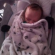 Lena joined the competition — help win amazing prizes! baby, blanket, sleeping, infant, baby_seat, cozy, soft, cute_pattern, pacifier, indoor, child, comfort, peaceful, wrapped, head, face, clothing, rest, warm, cushion