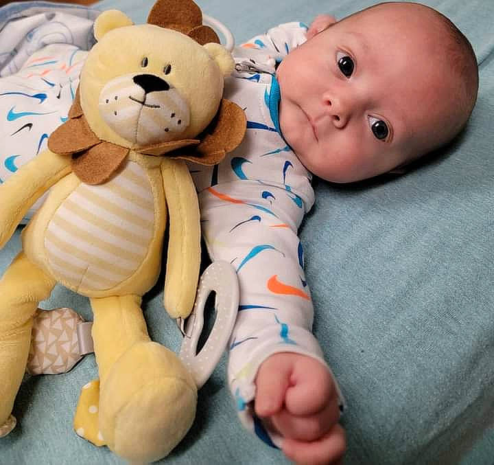 Kingston is registered to the contest to win money with this photo: arm, baby_sleeping, baby_toddler_clothing, cheek, child, comfort, facial_expression, finger, head, human_body, mammal, nose, person, product, skin, stuffed_toy, teddy_bear, textile, toy, vertebrate