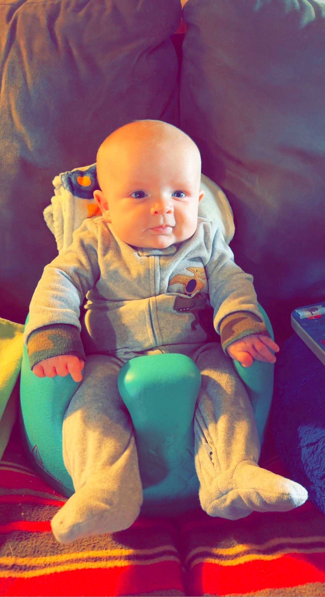 Casey is registered to the contest to win money with this photo: baby, baby_toddler_clothing, cheek, comfort, electric_blue, eye, finger, fun, happy, human_body, lap, mouth, person, pink, sitting, skin, sleeve, smile, thumb, toddler