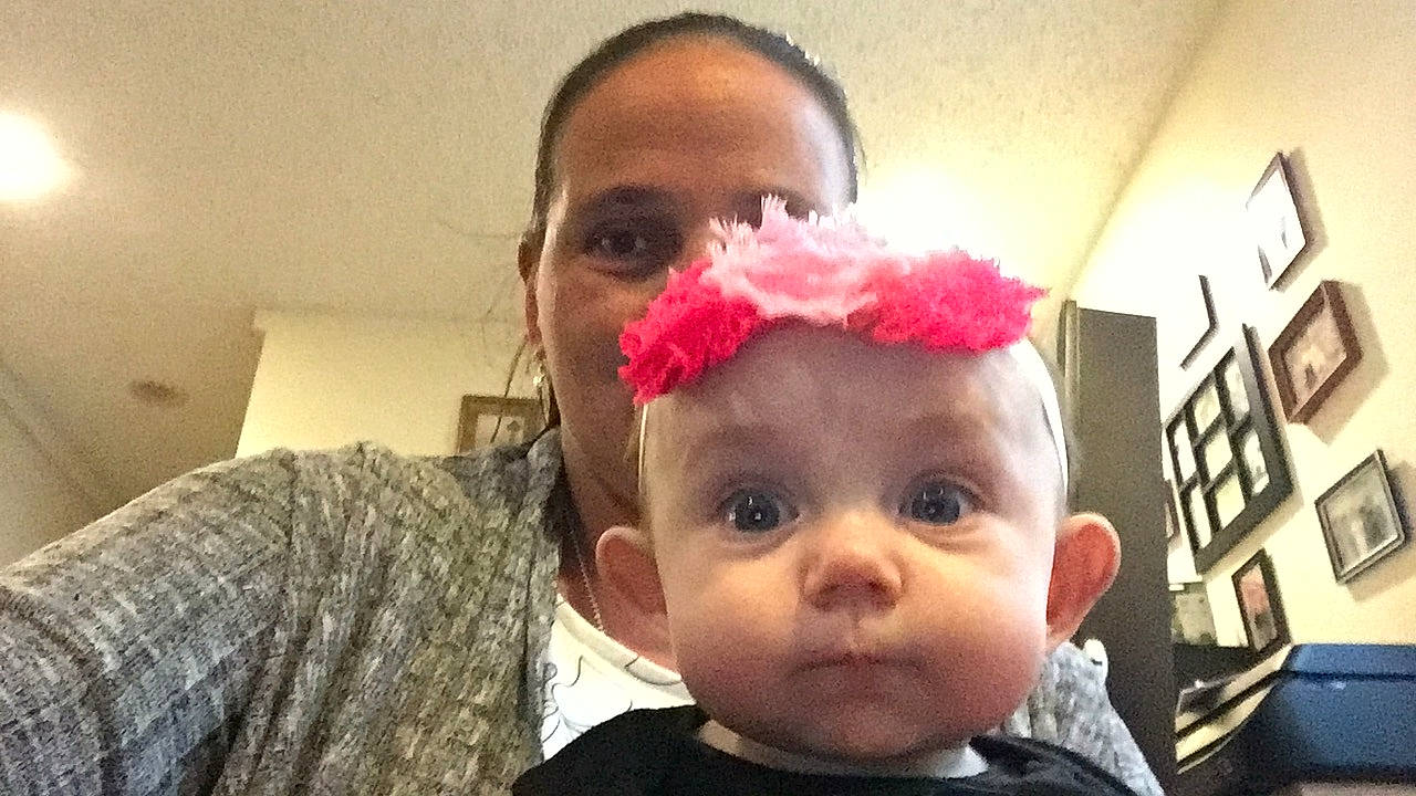 Avienda is registered to the contest to win money with this photo: baby, cheek, child, ear, eyebrow, face, forehead, hair_accessory, head, headgear, lip, mouth, nose, person, photography, pink, selfie, smile, toddler