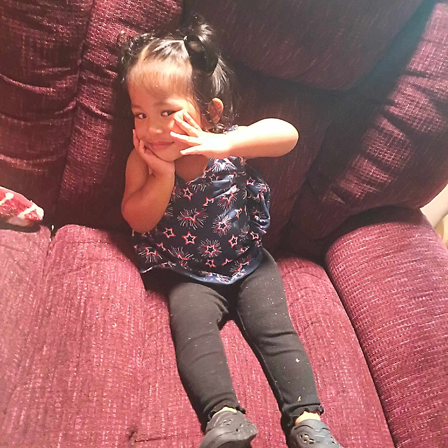Hosmi joined the competition — help win amazing prizes! child, girl, smiling, posing, sitting, armchair, plush_furniture, maroon, hair_buns, star_pattern, top, leggings, black_shoes, indoor, cute, portrait, young_child, playful, comfortable, cozy