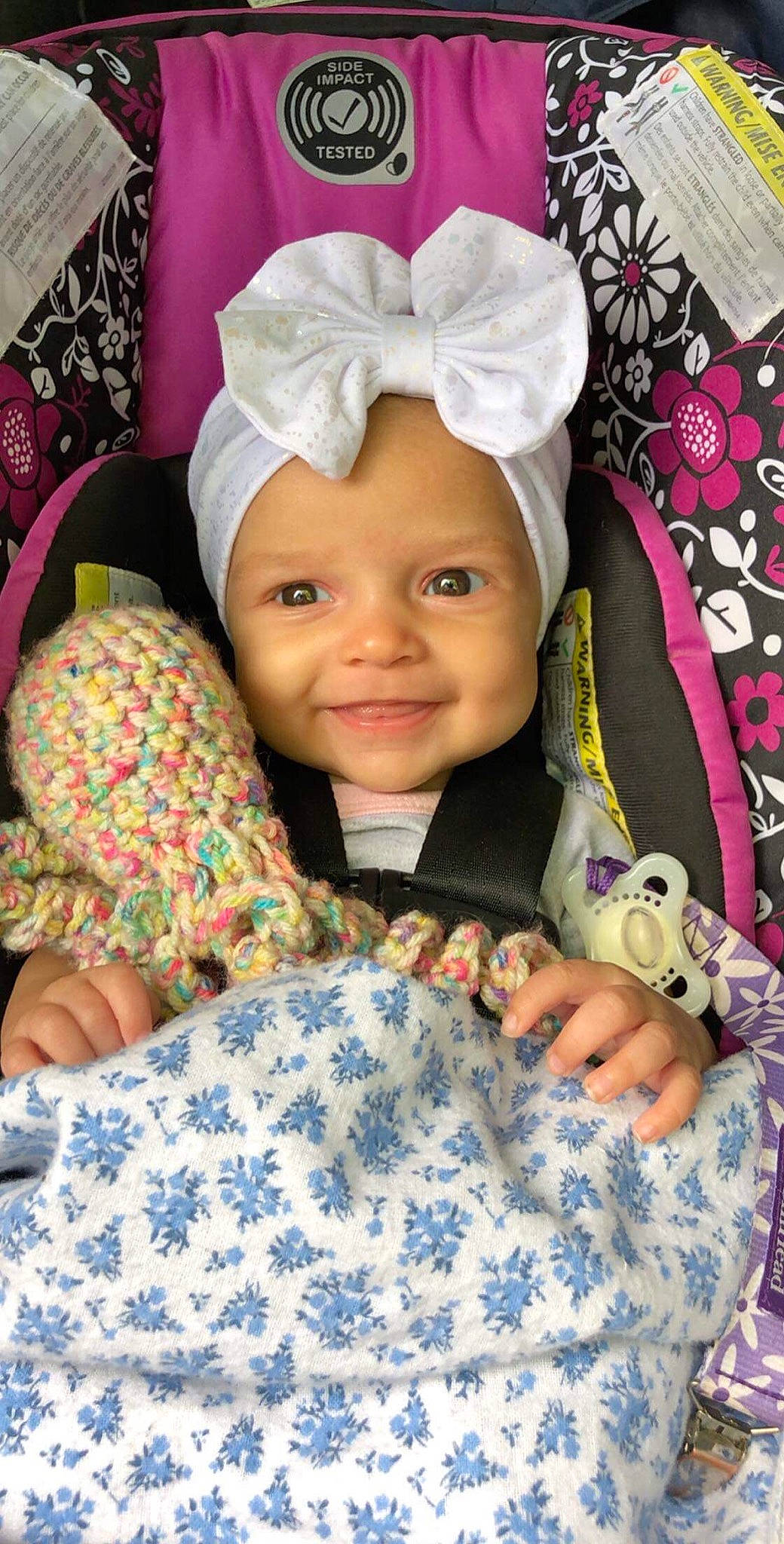 Aliza is registered to the contest to win money with this photo: baby, baby_products, cheek, child, head, headgear, joy, linens, pattern, person, pink, product, smile, textile, toddler