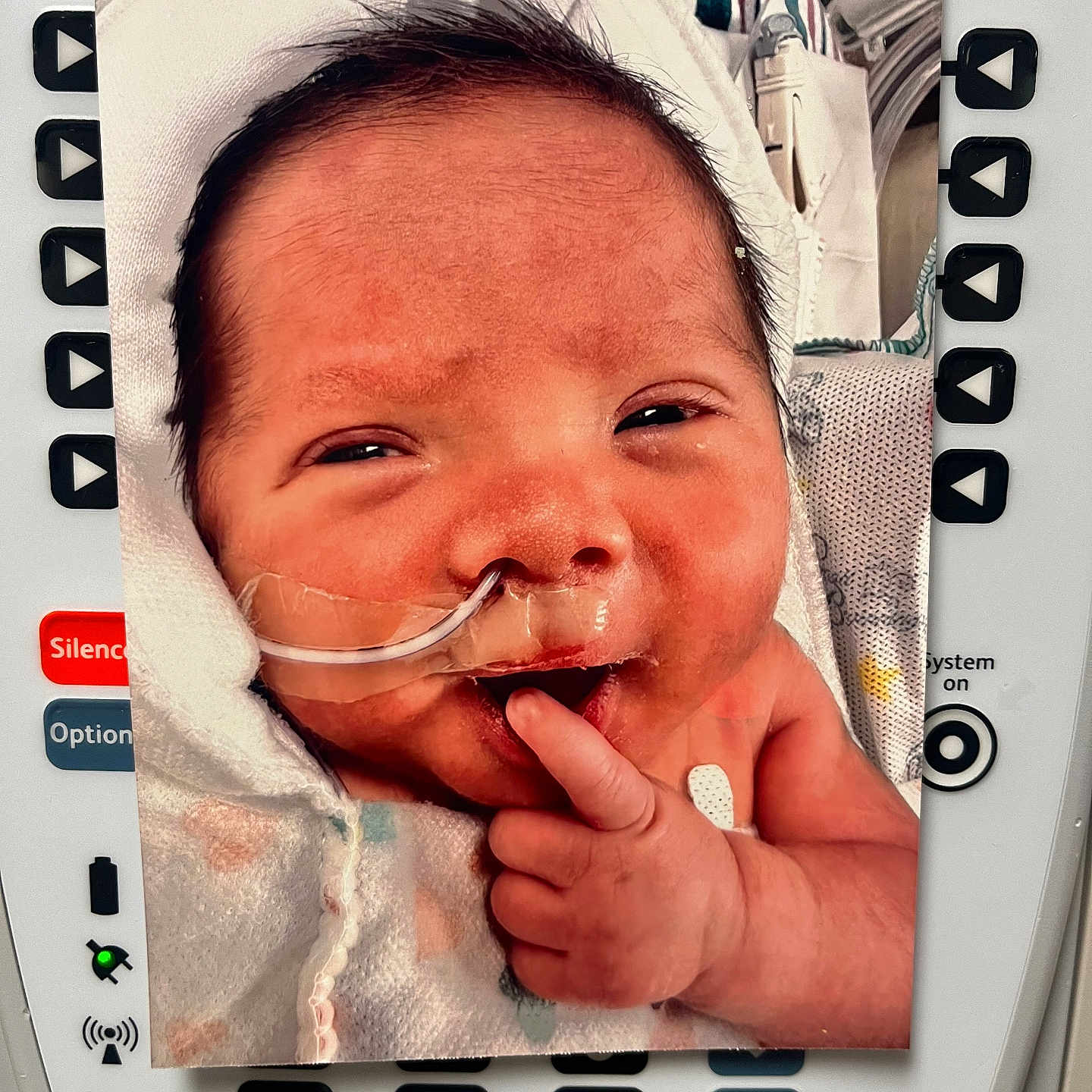 Kowen is registered to the contest to win money with this photo: accessories, architecture, baby, bodypart, bonnet, building, clothing, face, finger, hand, hat, head, hospital, medication, mouth, newborn, person, photography, pill, portrait