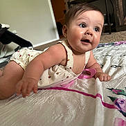 Jazlyn joined the competition — help win amazing prizes! baby, infant, child, blanket, floor, indoor, curious, reaching, clothing, cute, face, person, head, skin, expression, eyes, mouth, hand, toddler, carpet