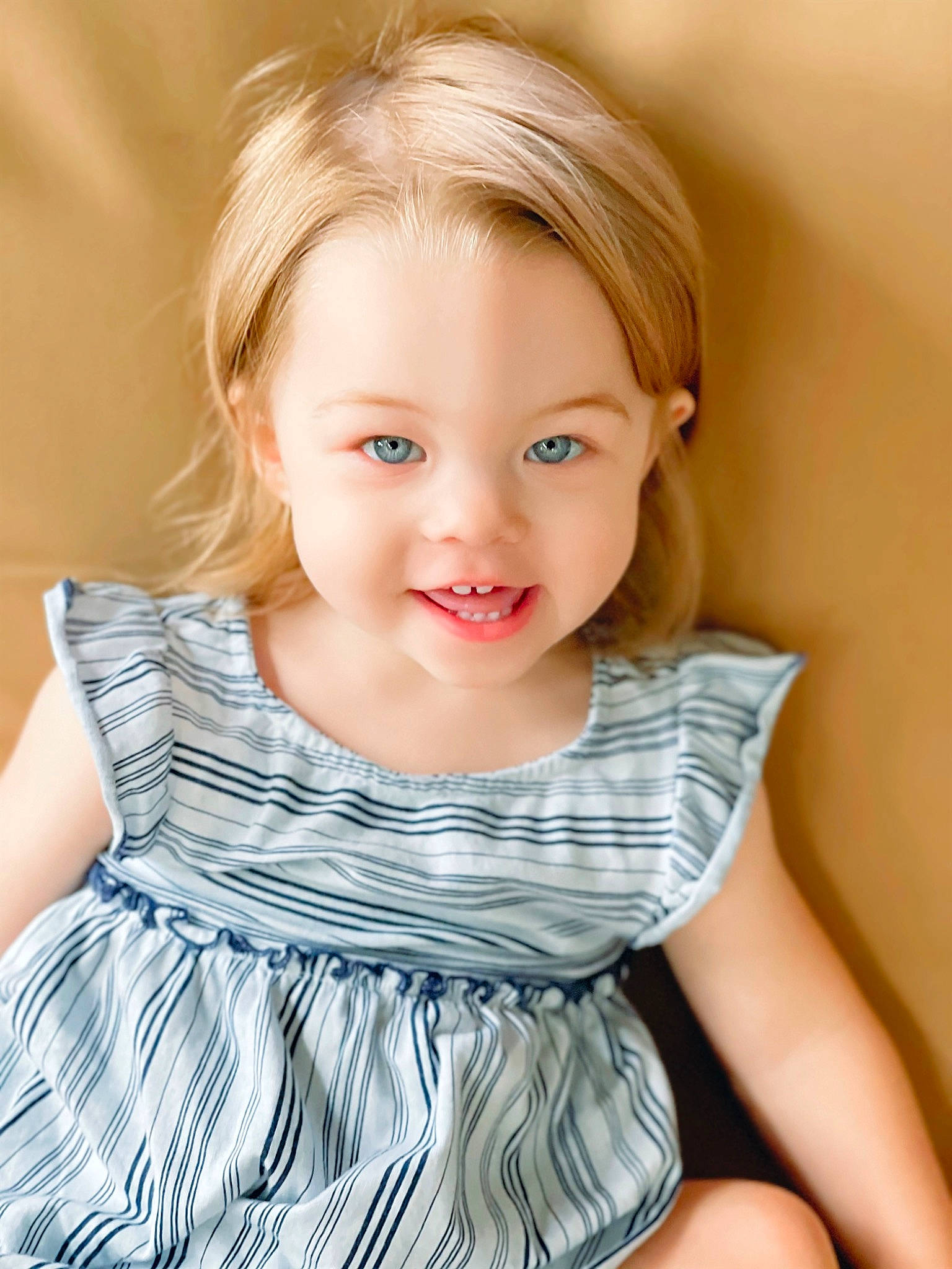 Alayah is registered to the contest to win money with this photo: baby_toddler_clothing, blond, cheek, child, day_dress, dress, facial_expression, flash_photography, hair, happy, head, iris, joy, neck, one_piece_garment, pattern, person, shoulder, skin, sleeve