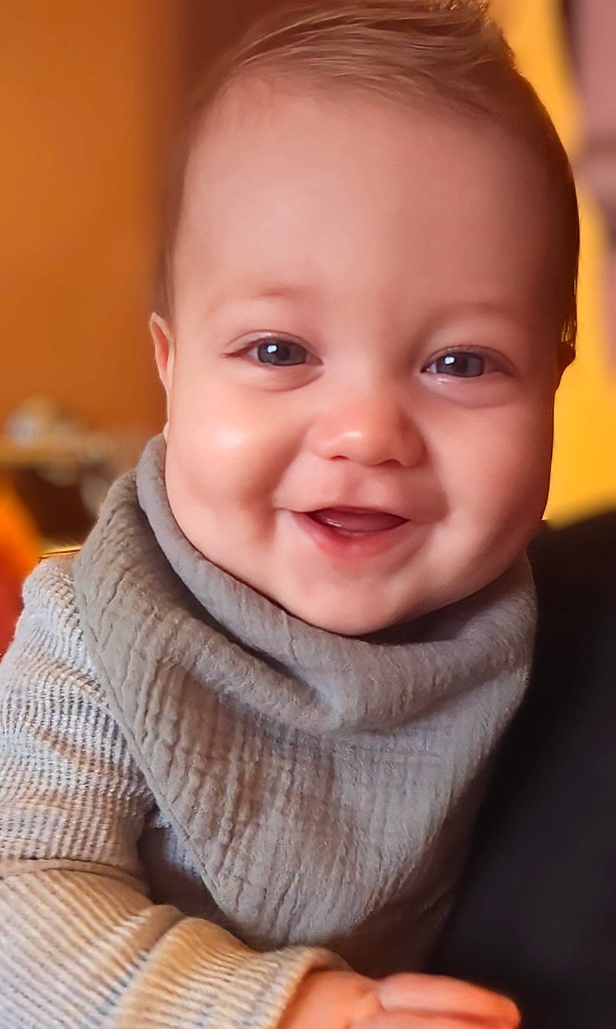 Samuel is registered to the contest to win money with this photo: baby, baby_toddler_clothing, blond, cheek, chin, collar, eye, eyebrow, flash_photography, fun, gesture, happy, iris, joy, lip, mouth, nose, person, skin, sleeve