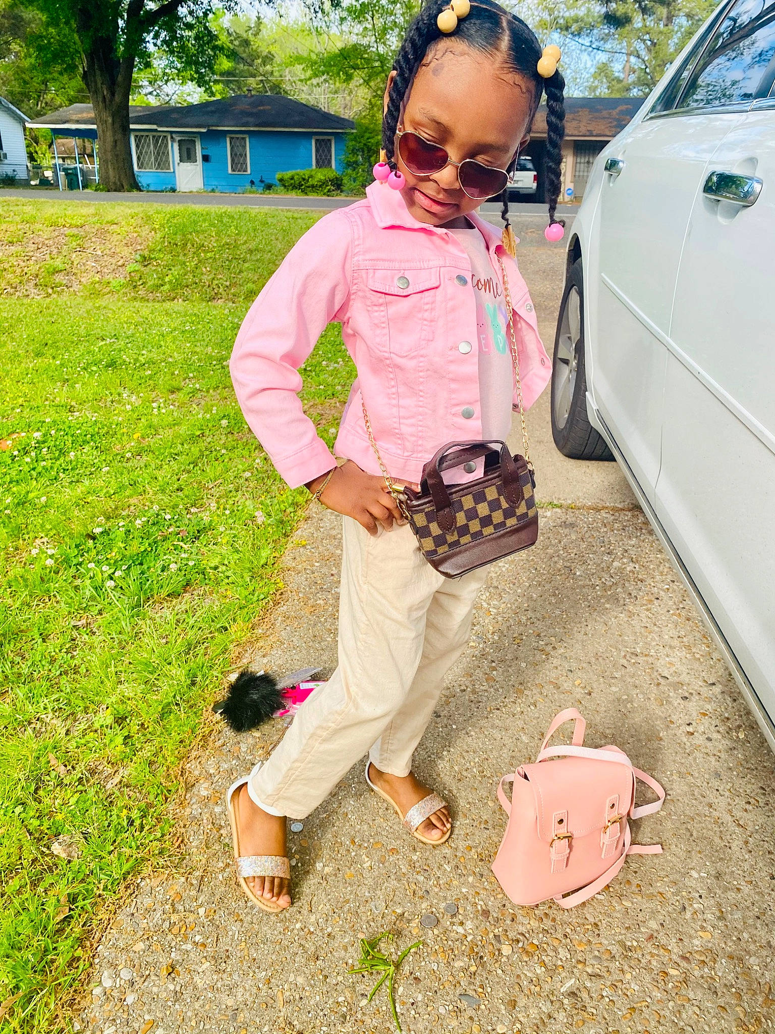 Londyn joined the competition — help win amazing prizes! bag, car, eyewear, goggles, grass, green, happy, leisure, luggage_and_bags, person, pink, plant, shoe, sneakers, sunglasses, tire, toy, tree, trunk, waist